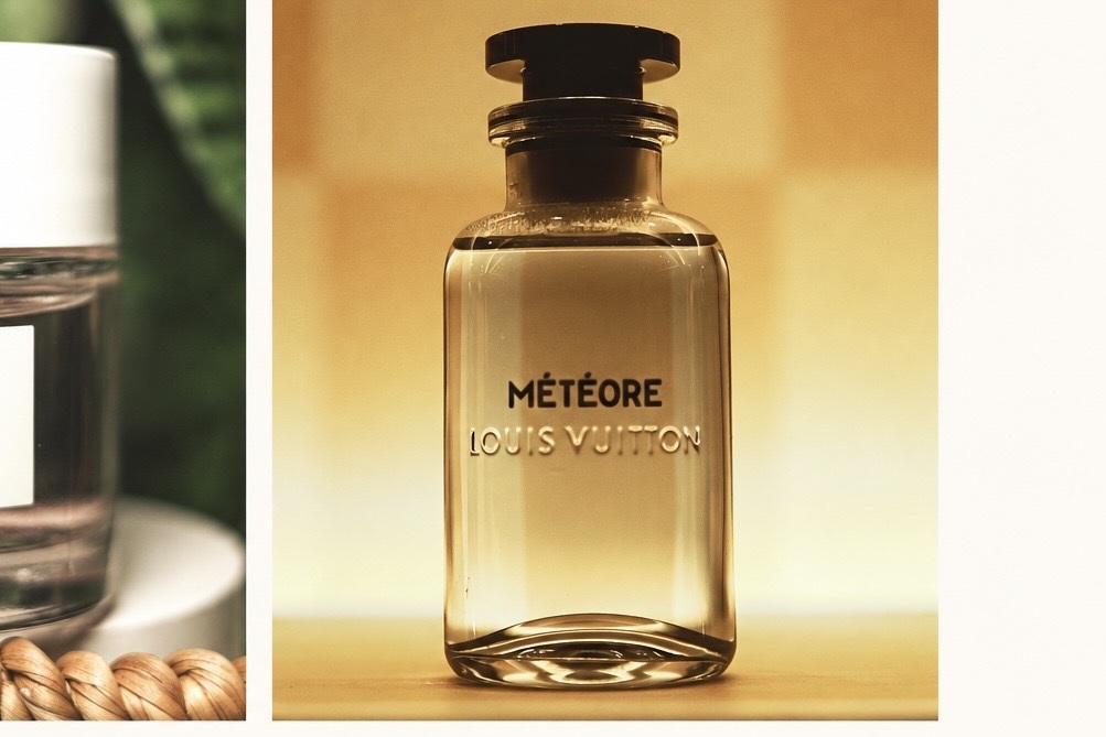 Louis Vuitton Météore perfume bottle in warm golden light within a cream presentation